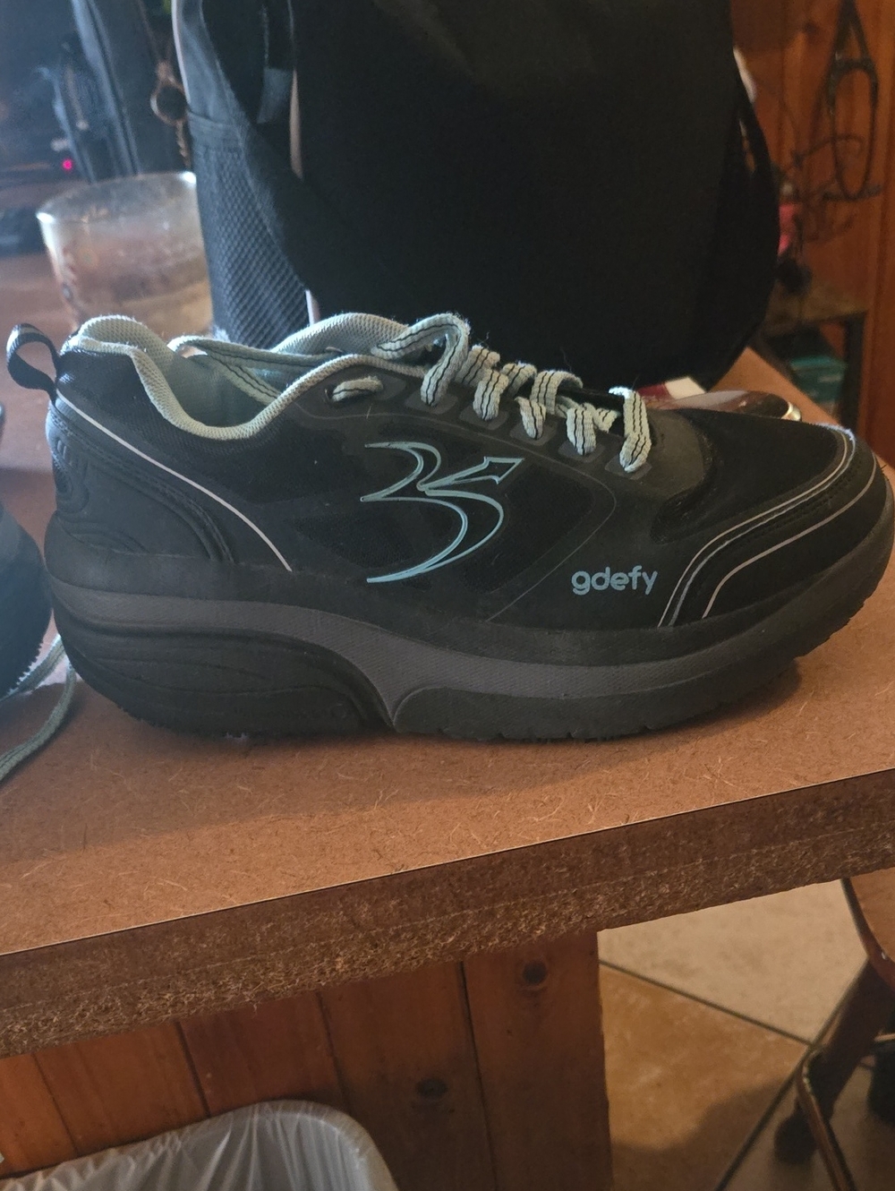 gdefy Women's Black Athletic Shoes with Light Blue Accents